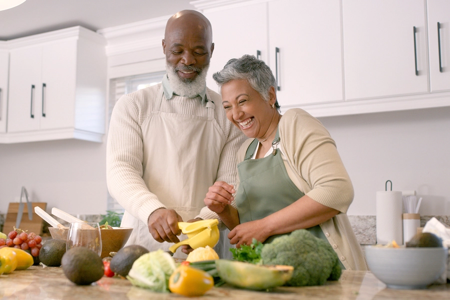 Couple preparing vegetables